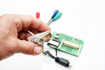 Digital plug in a hand on a white background