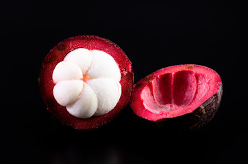 Mangosteen fruit on a black background