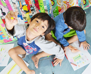 Fototapeta premium Sibling boys drawing and coloring