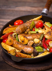 Sausages and vegetables in the pan