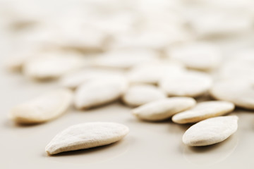 Organic white pumpkin seeds shot in an abstract manner