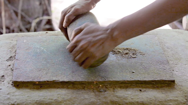 Production spice mixtures with stone tool. Ancient method.