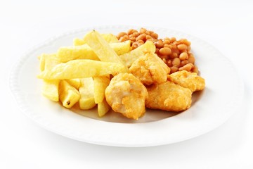 chicken nuggets, chips and beans on white plate