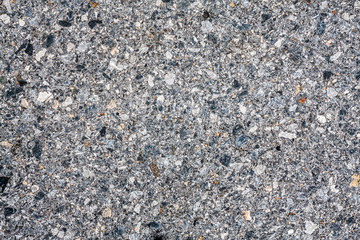 Dark asphalt with gravel texture