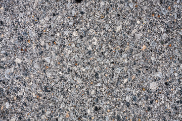 Dark asphalt with gravel texture