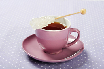 Tea in cup with candy sugar