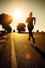 Woman running on sunset - 56061015