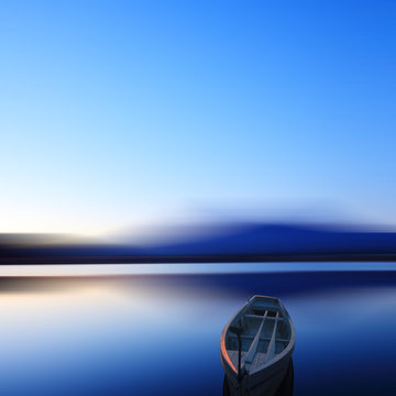 Single boat in long exposure in dusk