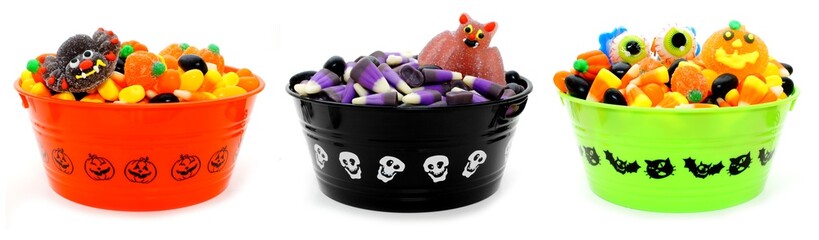 Three unique Halloween bowls filled with assorted candy - Powered by Adobe