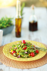 Fresh salad served on vintage plate