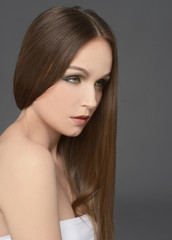 Naklejka premium young sexy girl with long hair on black background