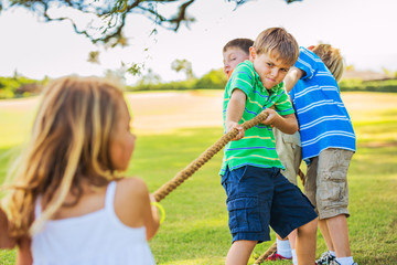 Fototapeta premium Kids playing Tug of War