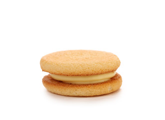 Biscuit sandwich with white filling.