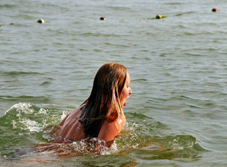Woman is swimming.