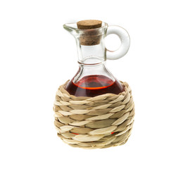 Small decanter with red wine vinegar isolated on the white