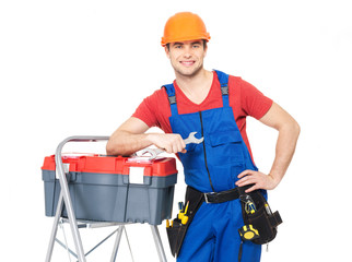 smiling manual worker with tools