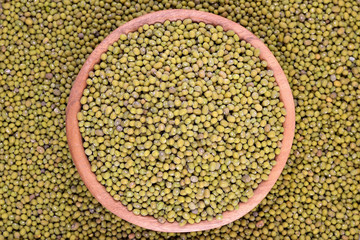 Green mung beans in a wooden bowl