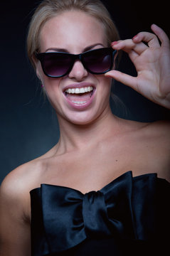 Funny blond wearing sun glasses