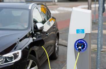 Electric car at charging station