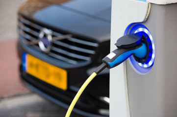 Electric car at charging station