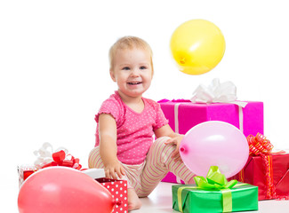 Fototapeta na wymiar Happy child girl with balloons and gifts