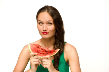 Beautiful woman eating a green ripe melon slice