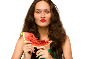 Beautiful woman eating a green ripe melon slice