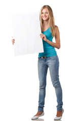 Fototapeta na wymiar Full length beautiful female showing blank whiteboard