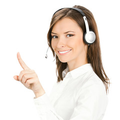 Young phone operator in headset pointing