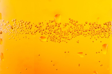 bubbles beer over yellow