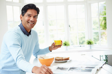 Indian Man Enjoying Breakfast At Home