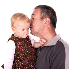 Man holding small child in her arms