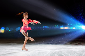Fototapeta na wymiar Little girl figure skating