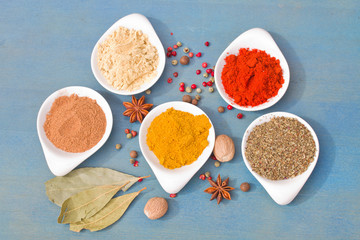 mix of spices on blue  table