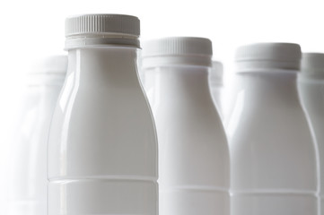 Group of white plastic milk bottle on white background
