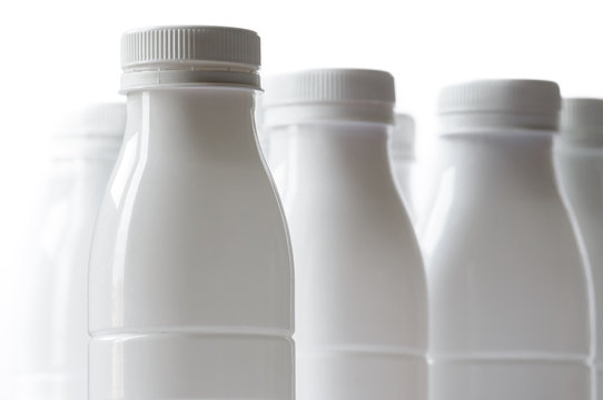 Group Of White Plastic Milk Bottle On White Background