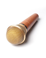 Gold color Microphone close up view with White background