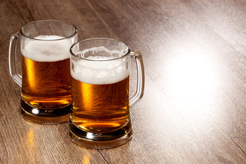 Two glass beer on wooden table