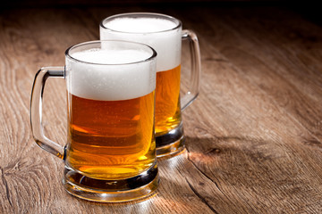 Two glass beer on wooden table