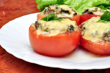 Tomatoes stuffed with mushrooms in cream sauce