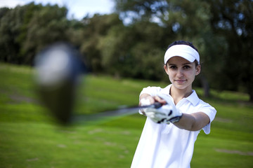 Fototapeta na wymiar Portrait of a woman playing golf