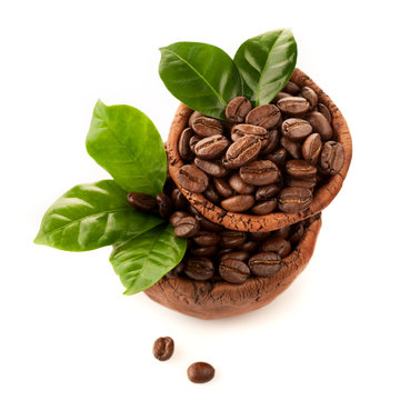 Bowl of coffee beans on a white background