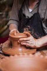Potter working a piece of clay