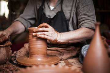 Potter working a piece of clay
