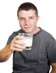 Healthy Young  Man drinking a Glass of Milk