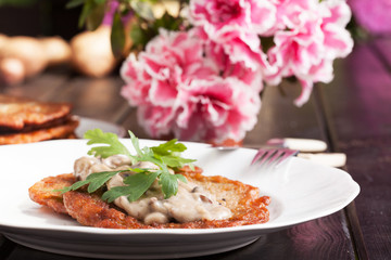 Potato pancakes with mushroom sauce