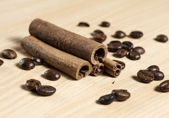 cinnamon sticks and spilled coffee beans