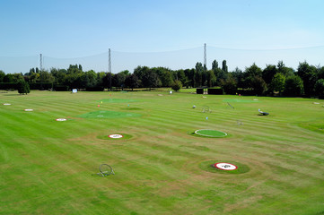 Golf driving range with distance markers