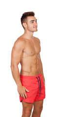 Fototapeta premium Handsome lifeguard with red swimsuit