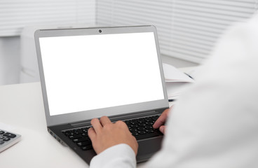 office desk and laptop computer with blank screen